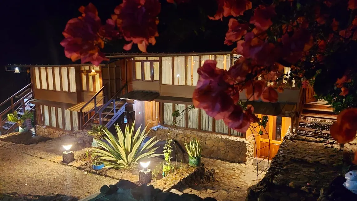 Bethel Varkis heritage house lit up at night